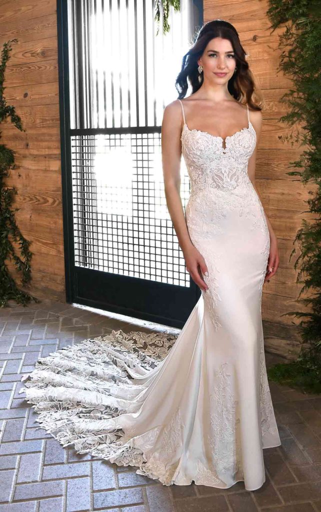 D3458-essense of australia-pure bridal, mikado wedding dress, fit and flare , straps, Breath-taking. Sophisticated. Bold. Style D3458 is the ultimate wedding day look for the high-fashion bride. The bodice is covered in intricate layers of floral lace, sparkling sequins and sheer details for a sexy, sleek look. Delicate wide-set straps with a straight-across neckline provide effortless support in the front, while beautifully framing the open back. The simple skirt features thoughtfully placed lace appliques for a chic, cohesive gown. The full train is adorned in stunning large-scale floral patterns all the way to the hem, complete with fabric-covered buttons trailing the entire length of the skirt and train. This wedding dress cant help but make your walk down the aisle a show-stopping moment.
